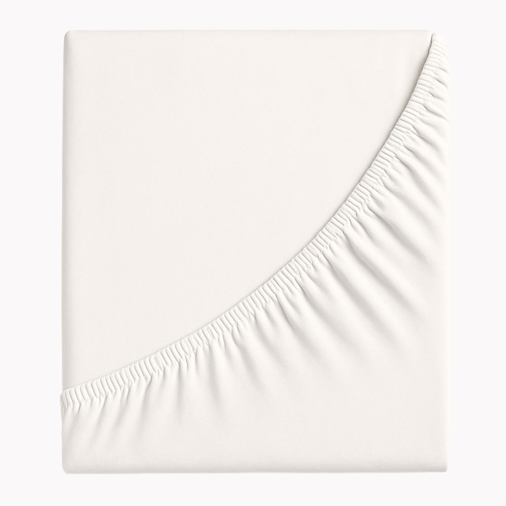 Zwirnjersey-Spannbetttuch in hellem Beige mit elastischem Rundumgummi, gefaltet dargestellt