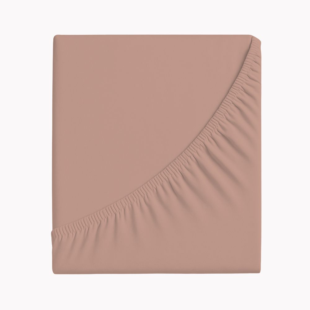 Zwirnjersey-Spannbetttuch in zartem Roséton gefaltet dargestellt