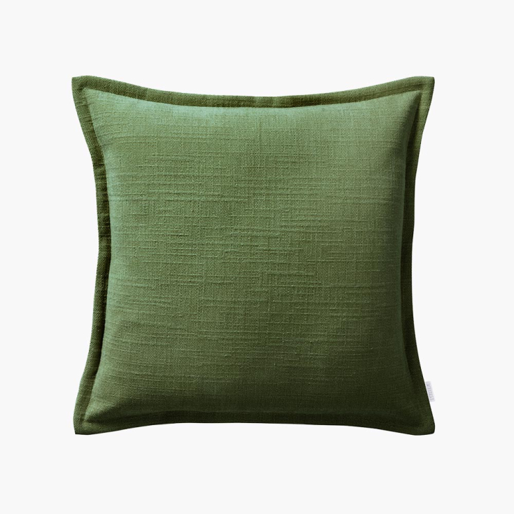 Quadratischer Dekokissenbezug mit einer markanten Struktur in einem kräftigen grün